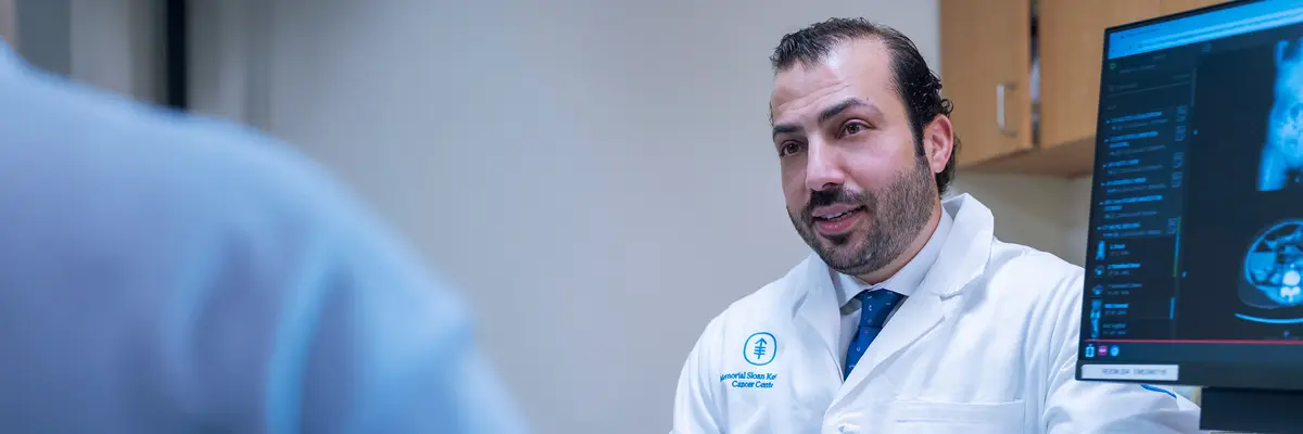 MSK colorectal surgeon Mohammad Ali Abbass, who sees patients in New York City and on Long Island, talks with his patient. 