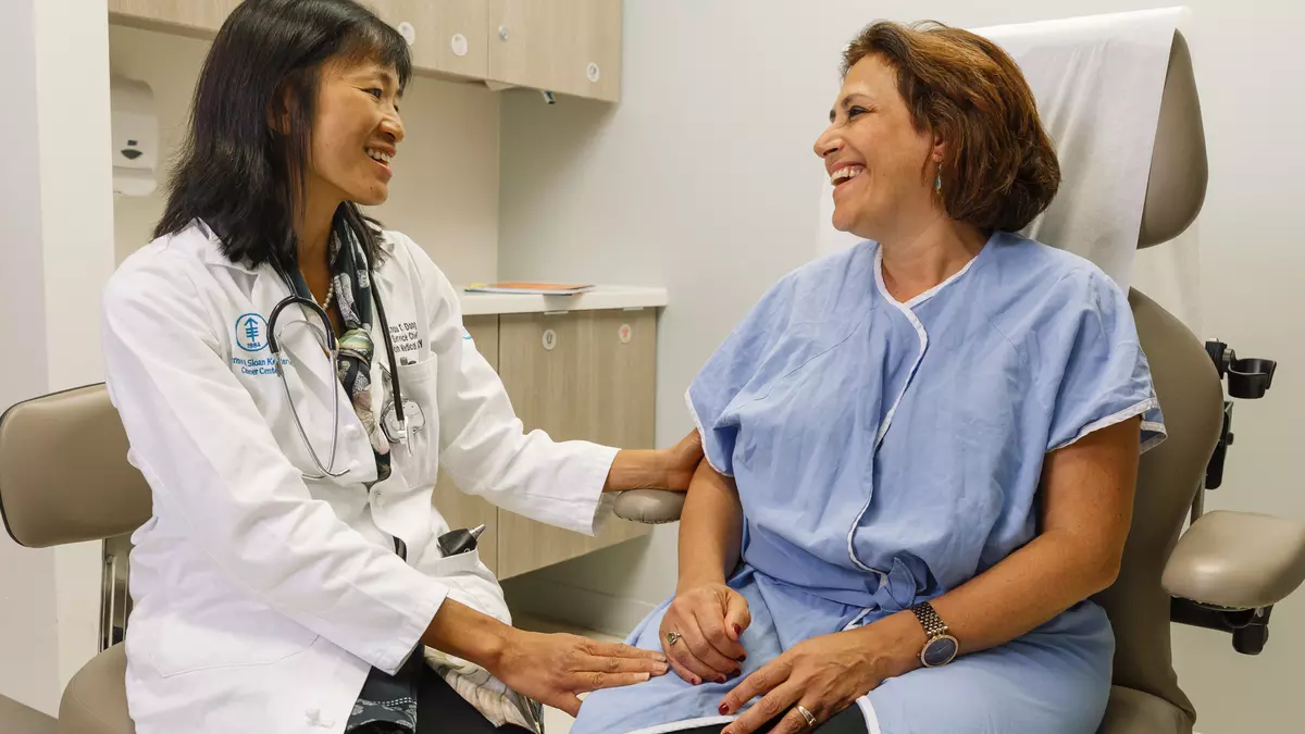Dr. Chau T. Dang, a breast medical oncologist, is with a patient.