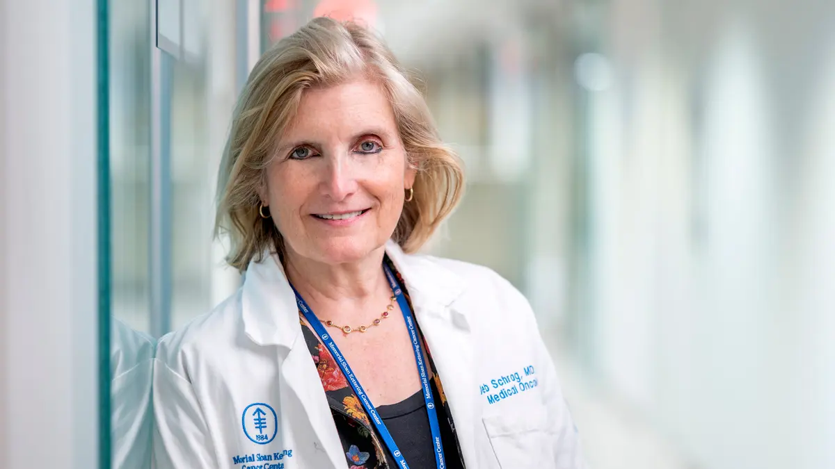 MSK gastrointestinal oncologist Dr. Deb Schrag is in a hallway at MSK in New York City.    