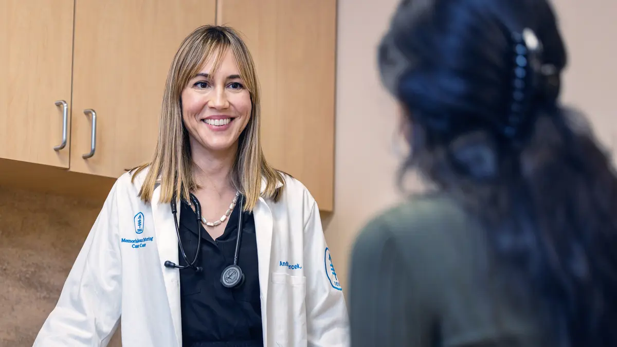 Gastrointestinal medical oncologist Dr. Andrea Cercek, talking with a patient, treats people with anal cancer in New York City. 