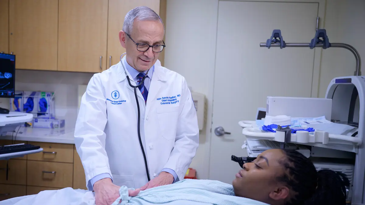 Colorectal surgeon Dr. Julio Garcia-Aguilar examines an MSK patient on an exam table in New York City. 