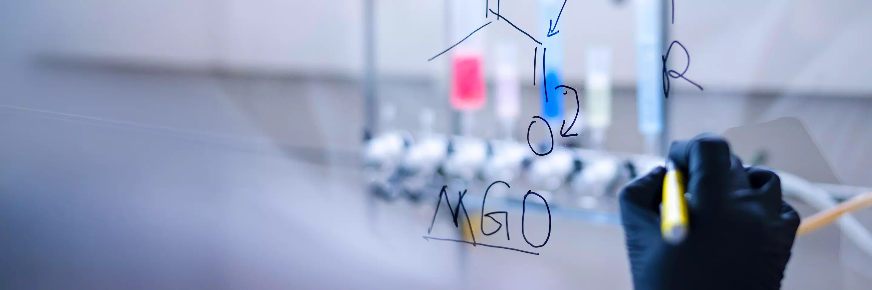 a person drawing on a whiteboard